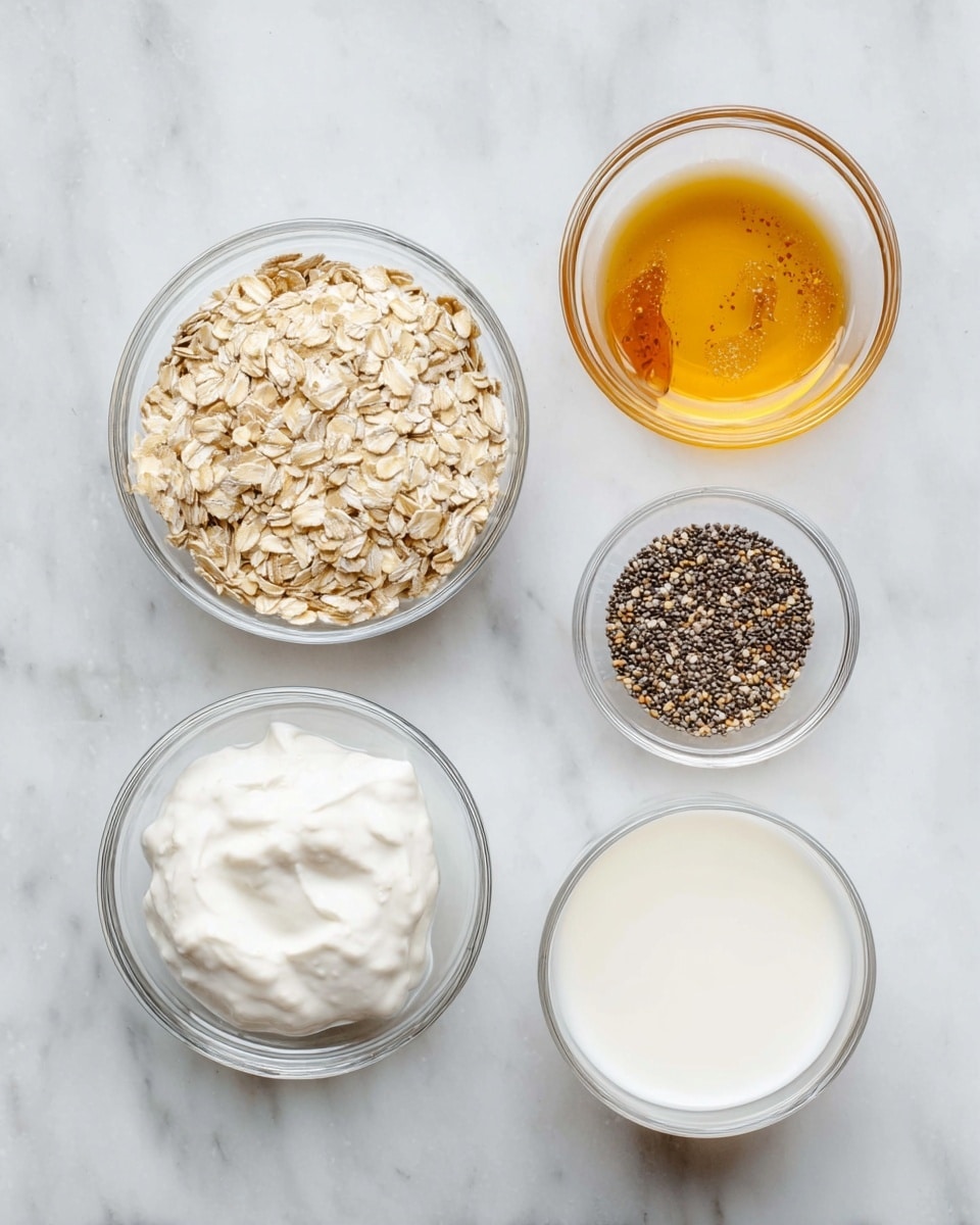 Six clear glass bowls sit on a white marbled surface, each containing different ingredients. One bowl is filled with pale beige rolled oats, another with small black and white chia seeds. There is a bowl with thick white yogurt, and two bowls with golden amber-colored honey or syrup, one slightly darker than the other. The last bowl holds smooth white milk. All bowls are evenly spaced with bright, natural light showing the textures clearly. Photo taken with an iphone --ar 4:5 --v 7