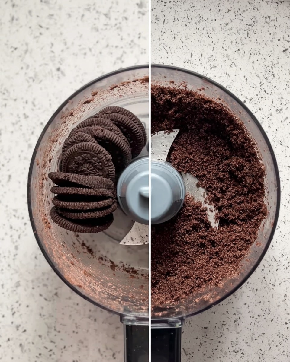 The image shows a clear food processor bowl on a white marbled surface. On the left side, the bowl contains whole round chocolate cookies stacked inside, with the blade visible in the center. On the right side, the same bowl shows the cookies finely crushed into a crumbly dark brown mixture that fills most of the bowl, the blade still in the middle. The background behind the food processor is black tile arranged in a brick pattern. photo taken with an iphone --ar 4:5 --v 7