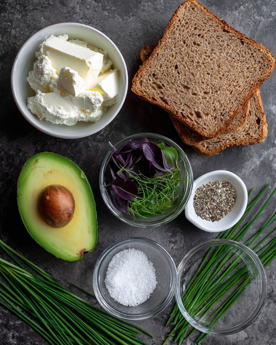 The image shows ingredients laid out on a dark surface with a white marbled texture added behind by instruction. Two slices of brown bread with a rough texture are stacked in the top right corner. Below and to the left is a halved avocado showing its smooth, bright green flesh and the large brown seed in one half. At the top left, a white round container holds creamy, white cottage cheese with a soft texture. In the center, a small clear glass bowl contains dark purple and green garnish leaves. To the bottom right of that bowl, a small clear glass bowl is filled with white salt and black pepper, showing a grainy texture. A bunch of fresh green chives with long thin stalks lies next to the bowl of salt and pepper. photo taken with an iphone --ar 4:5 --v 7