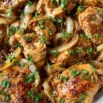 Baked Caramelized Onion and Chicken Thighs with Sun-Dried Tomatoes and Garlic Recipe