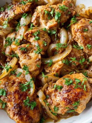 Baked Caramelized Onion and Chicken Thighs with Sun-Dried Tomatoes and Garlic Recipe