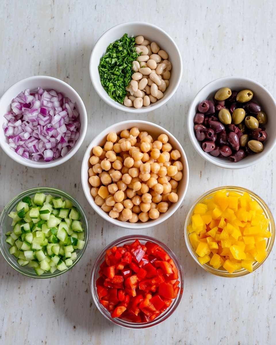 The image shows eight small white bowls arranged on a white marbled surface. In the center is a bowl filled with round, light brown chickpeas. Surrounding it are bowls with different chopped vegetables and herbs: top left has beige white beans, top center has chopped green herbs, top right holds sliced dark purple olives, middle left contains chopped red onions in a clear bowl, bottom left is filled with chopped green cucumbers, bottom center has bright red chopped bell peppers, and bottom right shows finely diced yellow bell peppers. The bowls are evenly spaced and the colors are bright and fresh. Photo taken with an iphone --ar 4:5 --v 7