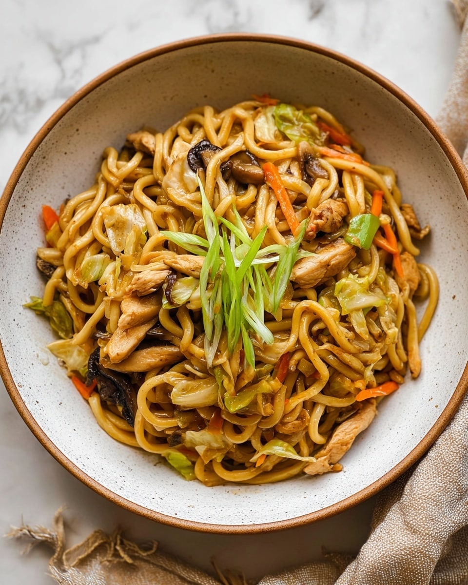 A bowl of stir-fried noodles with three main visible layers: the base layer is light golden-brown thick noodles, mixed with thin strips of orange carrots and light green cabbage pieces; the middle layer has light brown cooked chicken strips and dark brown mushroom slices scattered around; the top layer is a small bundle of thin, fresh green onion strips placed in the center. The bowl is white with a speckled gray inside and a thin brown rim, set on a white marbled surface with a beige cloth nearby. Photo taken with an iphone --ar 4:5 --v 7