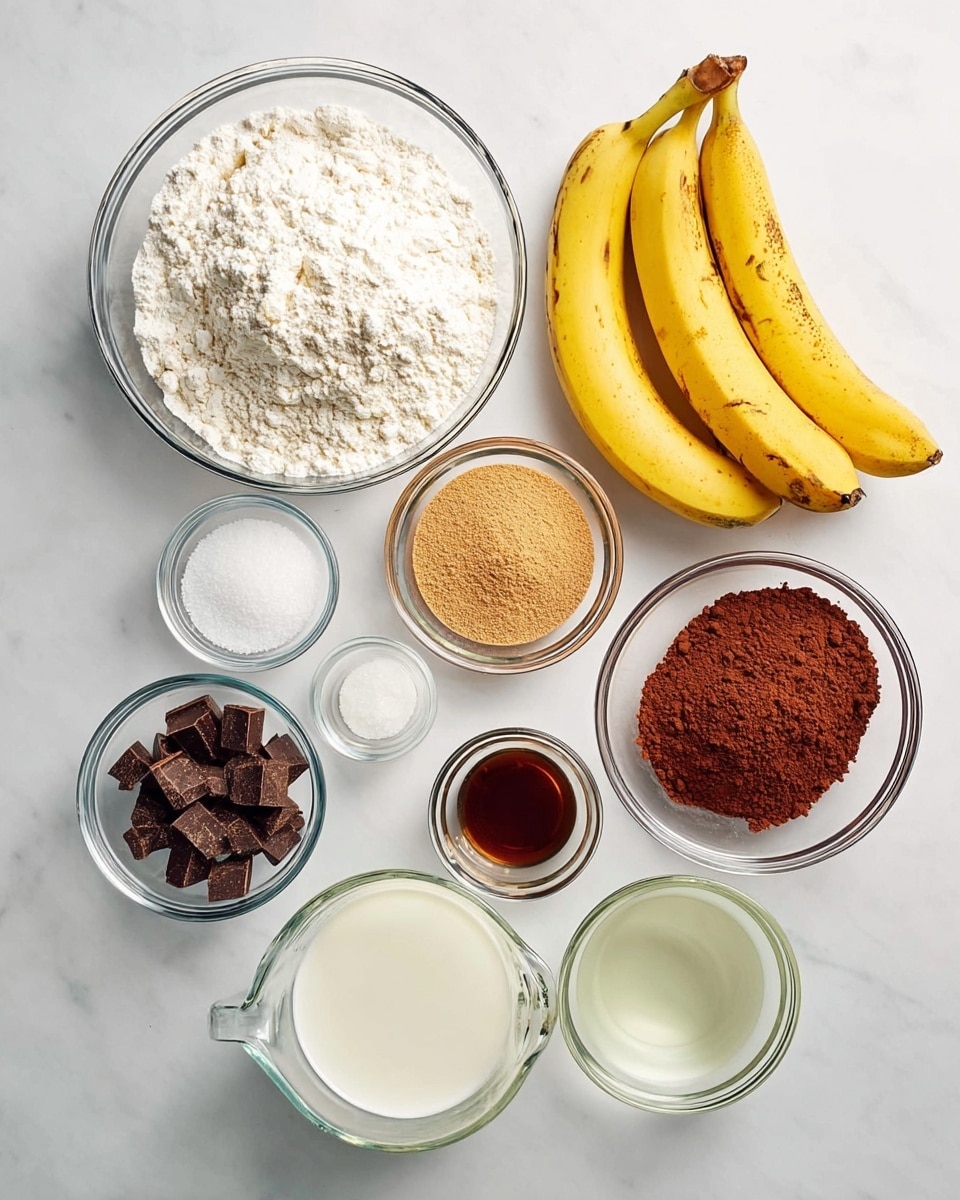 The image shows various baking ingredients laid out on a white marbled surface. There is a large glass bowl filled with white flour at the top left, and next to it on the right are three yellow bananas with some brown spots on the tips. Below the flour is a smaller glass bowl with light brown sugar, next to it on the right is a medium bowl with reddish-brown cocoa powder, and under that, a small bowl with dark chocolate chunks. To the left of the chocolate is a very small bowl with white baking soda, and above that is another tiny bowl with salt. In the middle, there is a small bowl with clear liquid oil, and to its right is a glass measuring cup filled with white milk. Next to the milk is a tiny bowl with vanilla extract, dark brown in color. All the containers are clear glass, arranged neatly in a balanced, clean style. photo taken with an iphone --ar 4:5 --v 7