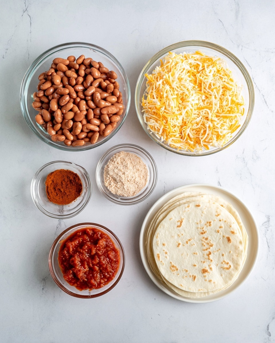 The image shows five items arranged on a white marbled surface: a large clear bowl filled with brown beans at the top left, a large clear bowl of shredded yellow and white cheese at the top right, a small brown bowl with a light brown powder below the beans, a small clear bowl of chunky red salsa below the powder, and a white plate holding a stack of white tortillas with light brown spots at the bottom right. photo taken with an iphone --ar 4:5 --v 7