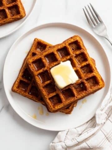 Pumpkin Waffles with Whipped Topping and Chopped Nuts Recipe