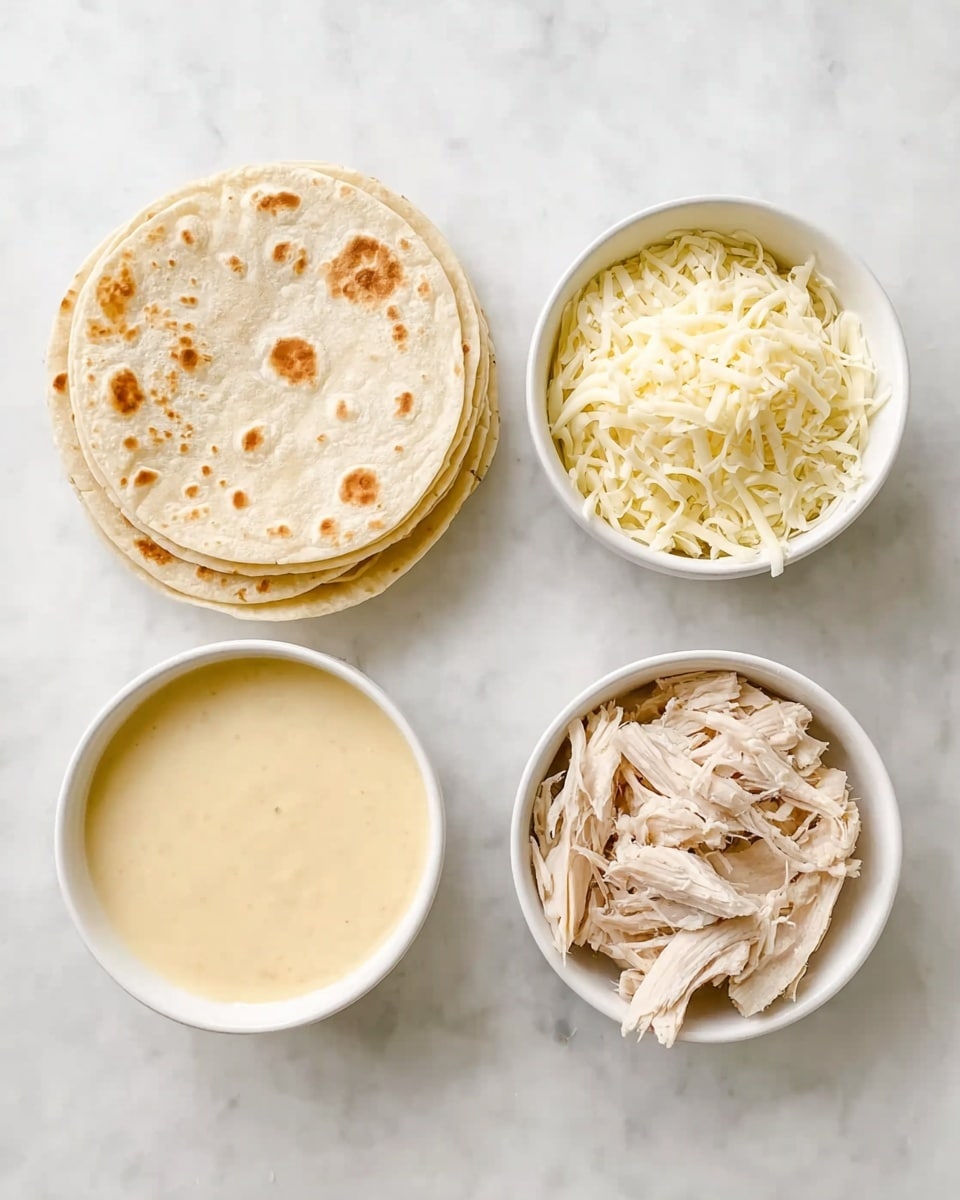The image shows four white dishes placed on a white marbled surface. In the top left, there is a stack of soft, round tortillas with light brown spots. On the top right, a bowl is filled with shredded white cheese. On the bottom left, there is a bowl of smooth, creamy sauce with a pale yellow color. On the bottom right, another bowl contains shredded cooked chicken with a light beige color and soft texture. photo taken with an iphone --ar 4:5 --v 7