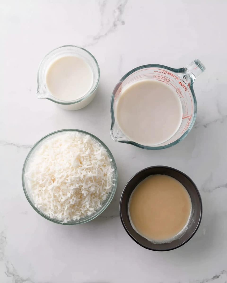 The image shows four clear glass containers on a white marbled surface. In the top left is a small clear glass pitcher filled with white liquid. Next to it, on the right, is a larger clear glass measuring cup with a handle, also filled with a slightly off-white liquid. Below these, on the bottom left, is a clear glass bowl filled with white shredded coconut. To the right of this bowl, there is a small black bowl holding a thick, beige liquid. photo taken with an iphone --ar 4:5 --v 7