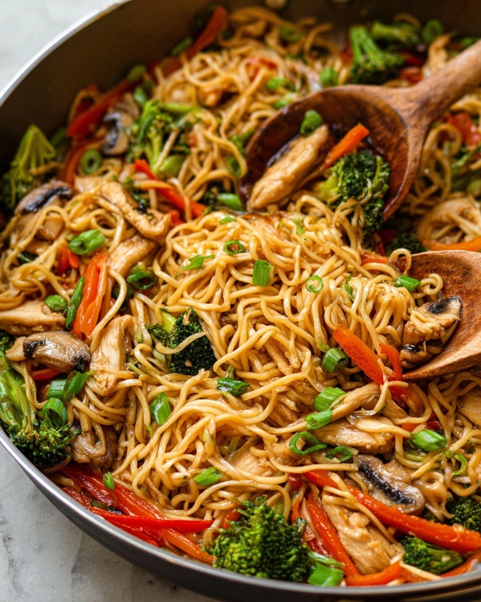 A close-up view of a pan filled with cooked stir-fried noodles, showing three main layers: the base layer of shiny, light brown noodles with a soft texture, scattered with thin slices of cooked white and light brown chicken pieces; the middle layer of bright green broccoli florets, thin orange carrot sticks, and long strips of red bell pepper adding fresh color; and the top layer of sliced shiitake mushrooms with a glossy brown surface and chopped green onions sprinkled throughout. Two wooden spoons rest in the pan, lifting some noodles, all on a white marbled background. photo taken with an iphone --ar 4:5 --v 7