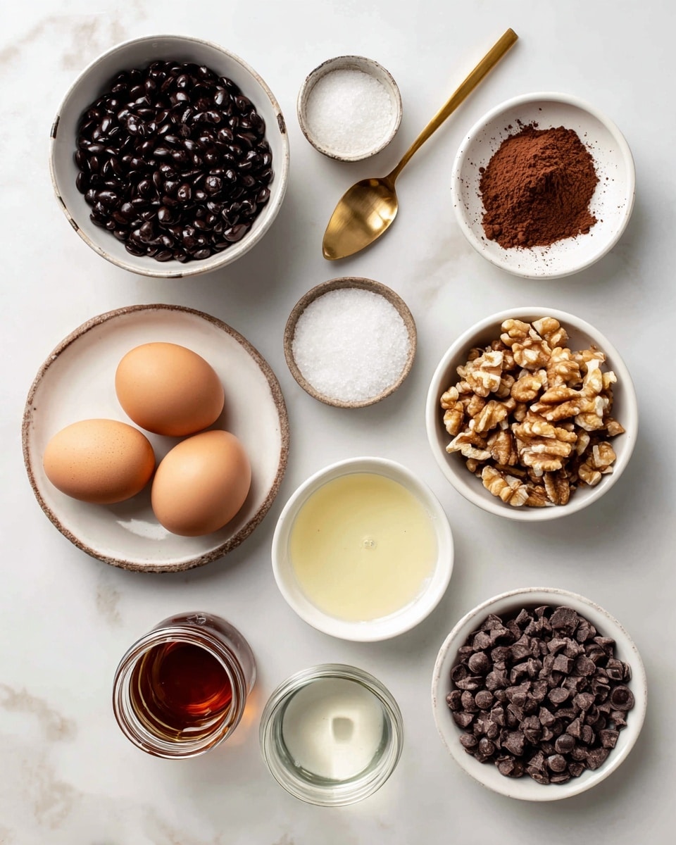 The image shows eight white bowls and one jar arranged on a white marbled surface, each holding different ingredients with labels. Starting from the top left, a large white bowl is filled with dark black beans. To its right, a gold spoon holds brown cacao powder. Nearby, a small white bowl contains white sea salt, next to it another small white bowl holds light golden vanilla liquid. Below, a medium white plate has three brown eggs. Toward the right, a white bowl contains chopped light brown walnuts. Below it, another white bowl is filled with dark brown chocolate chips. Below the eggs plate, there is a clear glass jar with dark amber maple syrup and in front, a small white bowl with clear coconut oil. All ingredients are neatly arranged, showing varied textures and colors on the white marbled background photo taken with an iphone --ar 4:5 --v 7