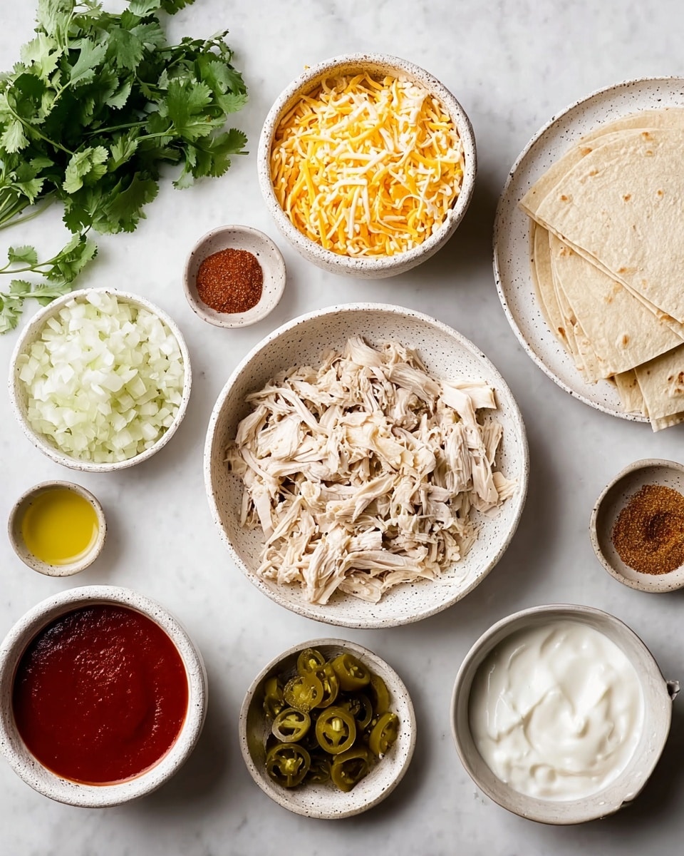 The image shows a white marbled surface with several white speckled ceramic bowls and cups arranged neatly. In the center is a bowl filled with shredded light beige chicken. To the upper left of the chicken is a bowl heaped with shredded yellow and white cheese. Below it is a white cup filled with red sauce. To the upper right of the chicken is a white plate stacked with cut pieces of light beige tortillas. Around these central bowls, there are smaller bowls containing finely chopped white onions, green pickled jalapeños, white sour cream, a small amount of yellow oil, and a small bowl of reddish-brown spice mix. A bunch of fresh green cilantro lies to the far left. The arrangement is clean and organized, perfect for preparing a dish. photo taken with an iphone --ar 4:5 --v 7