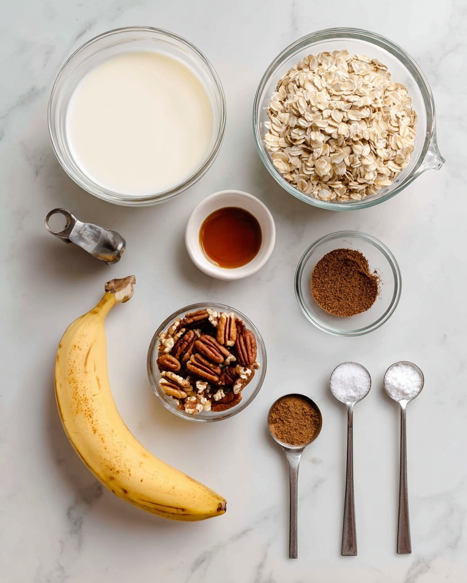 A white marbled surface holds several baking ingredients arranged neatly: a peeled yellow banana at the bottom left, a small white bowl of brown maple syrup near the top center, a glass bowl of creamy white milk to the left, and a metal measuring cup filled with light tan oats to the right. Below the oats is a clear small glass bowl of chopped pecans, next to a tiny glass bowl of dark amber vanilla extract. To the right, two silver measuring spoons hold dark brown cinnamon powder in the top one and white sea salt in the bottom one. All ingredients are spaced evenly, ready for mixing. Photo taken with an iphone --ar 4:5 --v 7