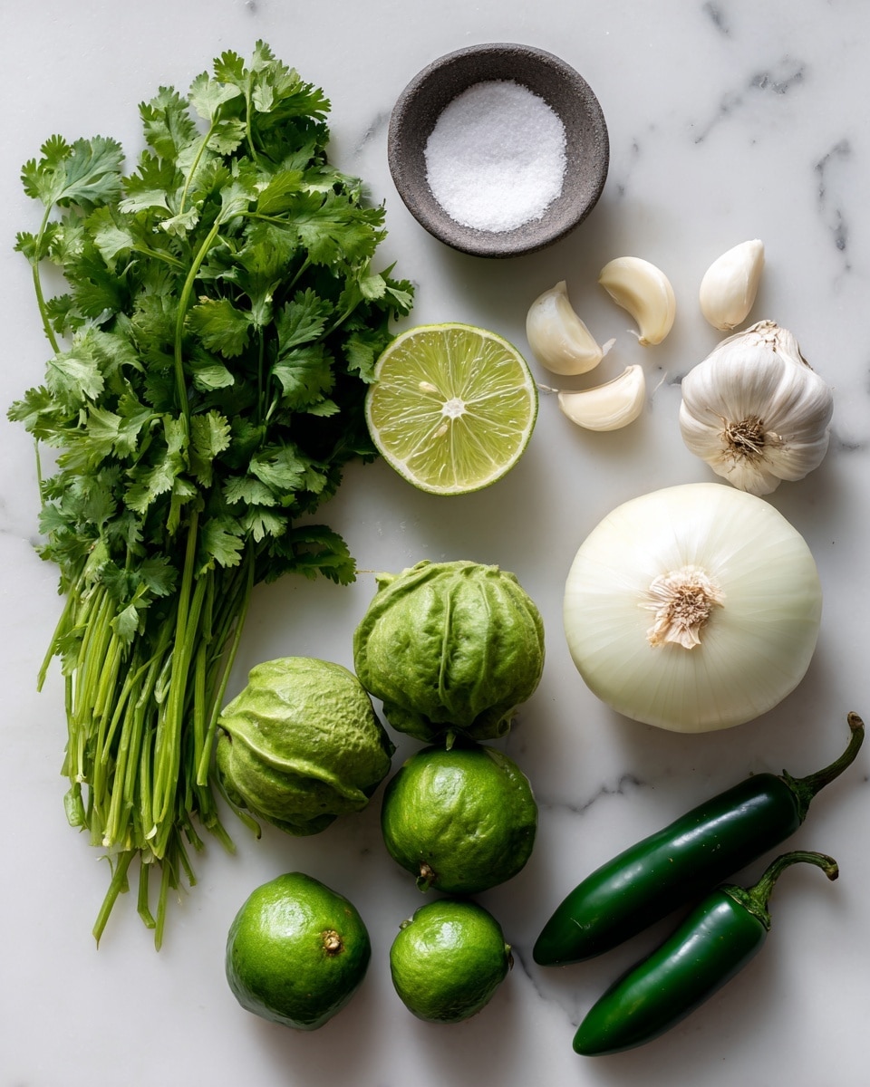 The image shows fresh ingredients arranged on a white marbled surface. On the left side, there is a bunch of green cilantro with long stems and leafy tops. Above it, there is a small round bowl filled with white salt. Near the top center, a lime is cut in half showing its bright green, juicy inside. To the right of the lime halves are three peeled garlic cloves, smooth and off-white. On the right side, a large whole white onion with a papery outer layer is placed. Below that onion, five green tomatillos, some with husks and some without, display their smooth, round shapes. Next to the tomatillos, two long, dark green jalapeños lie side by side. The ingredients are well spaced and clearly labeled with black text. photo taken with an iphone --ar 4:5 --v 7