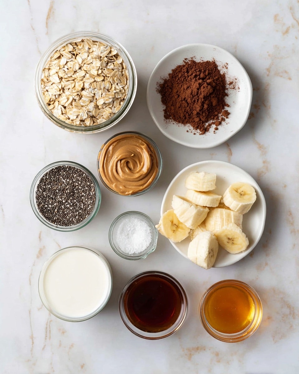 The image shows eight small white plates and glass jars arranged neatly on a white marbled surface. From the top left, there is a jar filled with light tan rolled oats. To its right, a white plate holds a heap of dark brown cocoa powder with a powdery texture. Below that, another white plate has a smooth scoop of light brown peanut butter, showing swirls on the surface. Next, a white plate contains half a banana cut into thick slices, with pale yellow inside and light spots on the peel. Below the oats, a jar is filled with tiny black and white chia seeds, bumpy in texture. Next to it, a small glass bowl has golden honey that looks thick and sticky. A white small glass holds creamy white milk, smooth in texture. Another small bowl holds a dark brown liquid, likely vanilla extract, glossy and rich. Finally, a tiny clear bowl contains coarse white salt granules. Photo taken with an iphone --ar 4:5 --v 7