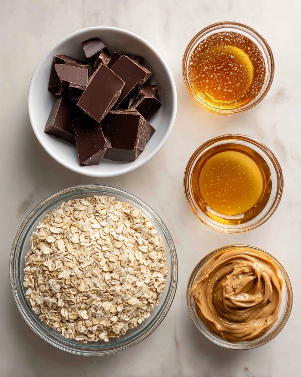 A top view shows four clear glass and white bowls arranged on a white marbled surface, each filled with different ingredients. At the bottom is a large clear bowl filled with light tan quick oats, showing their coarse and flat texture. Near the top left, there is a small white bowl holding a pile of dark brown square pieces of dark chocolate with sharp edges and smooth surfaces. To the top right, a small clear measuring cup contains shiny golden honey with small bubbles, and next to it, another small clear measuring cup is filled with smooth, creamy, light brown peanut butter with swirled patterns. Each ingredient is labeled with black text on a beige background close to its corresponding bowl. Photo taken with an iphone --ar 4:5 --v 7