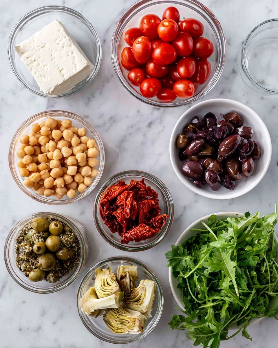 The image shows several clear glass bowls and tins arranged on a white marbled surface, each containing different ingredients. On the top left, there is a small glass bowl with a block of white feta cheese. Next to it on the right is a glass bowl filled with bright red cherry tomatoes. Beside that is a bowl with dark purple sliced olives. To the far right, a bunch of fresh green coriander/cilantro leaves is placed next to a white bowl full of dark green rocket/arugula leaves. Below on the left, there are two open tins filled with beige chickpeas. In the middle, three open small jars hold sun-dried tomatoes, roasted red peppers, and whole light-colored artichoke hearts arranged in a row. All ingredients contrast well with the clean white marbled surface. Photo taken with an iphone --ar 4:5 --v 7